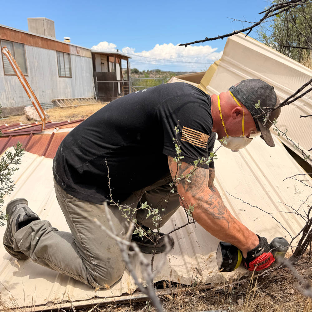 cyle working on a metal shed removal project